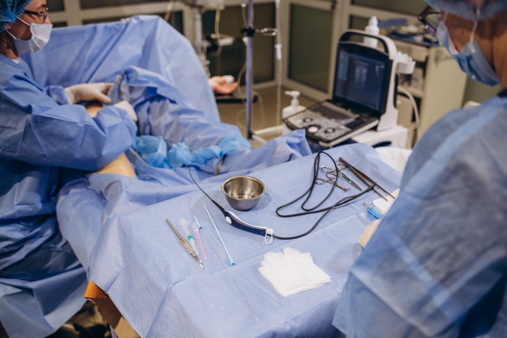 Close-up of sterilized and ready for use surgical instruments on medical tray during surgery operation in operating room at hospital